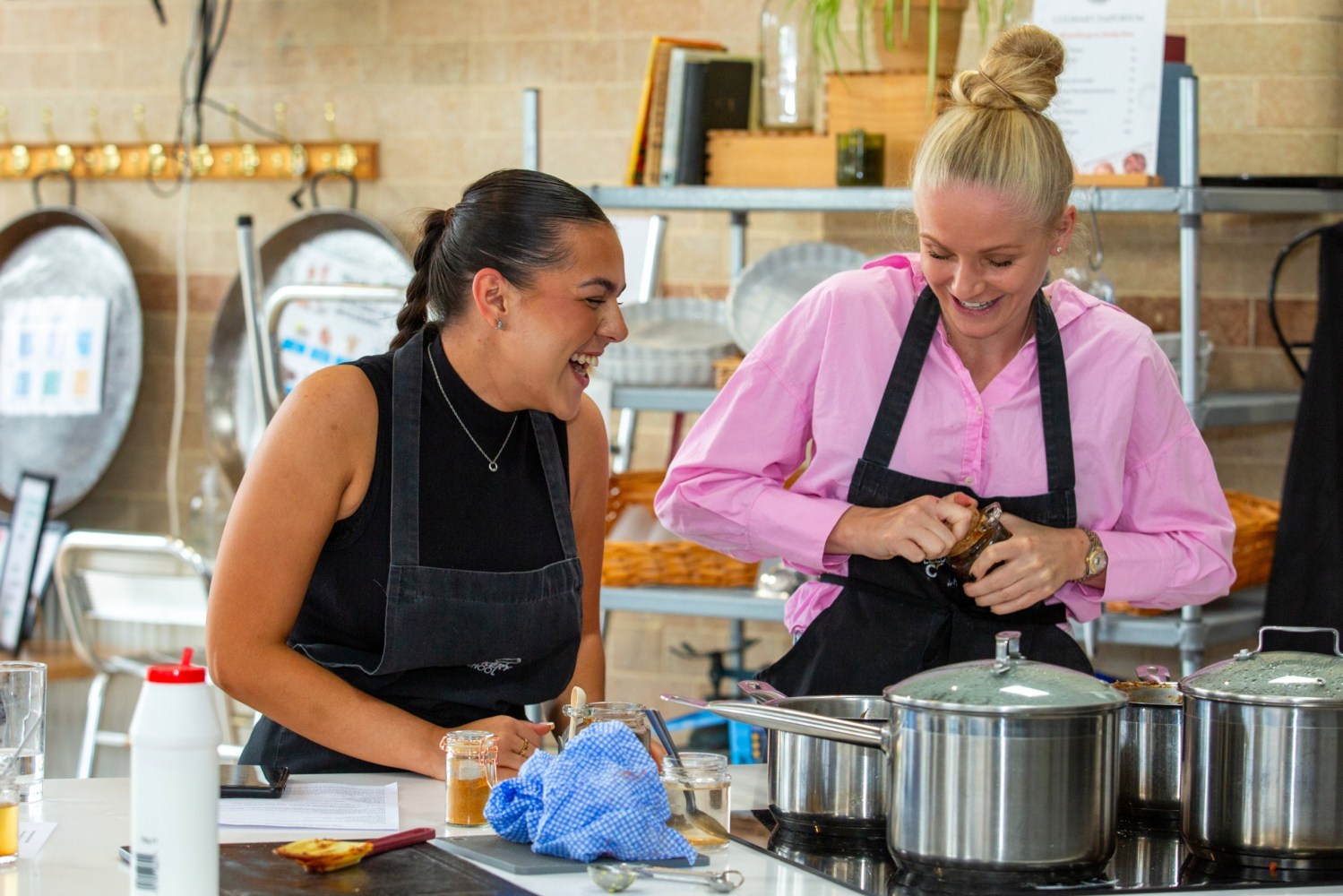 a group of people preparing food in a kitchen