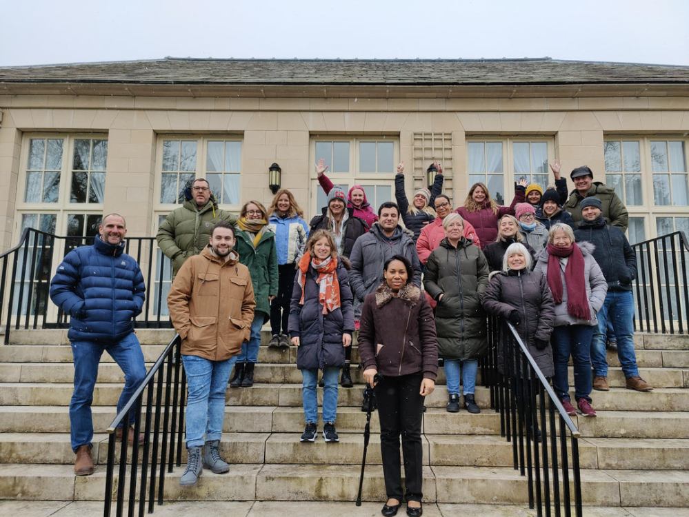 a group of people standing in front of a building