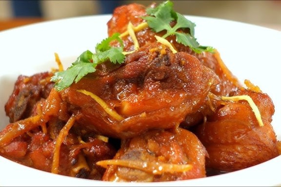 a plate of food with meat and vegetables
