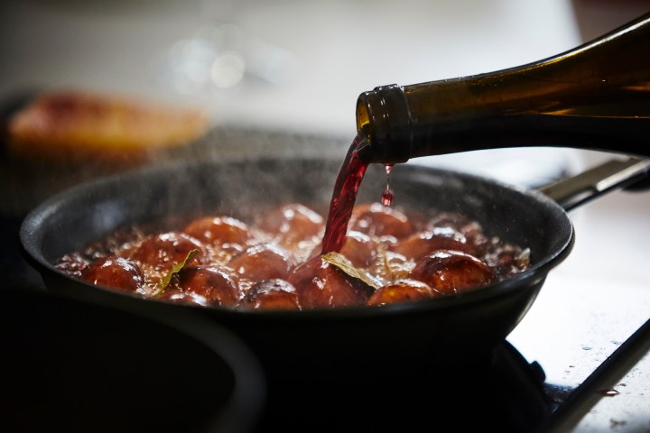 a bowl of food with a fork and knife