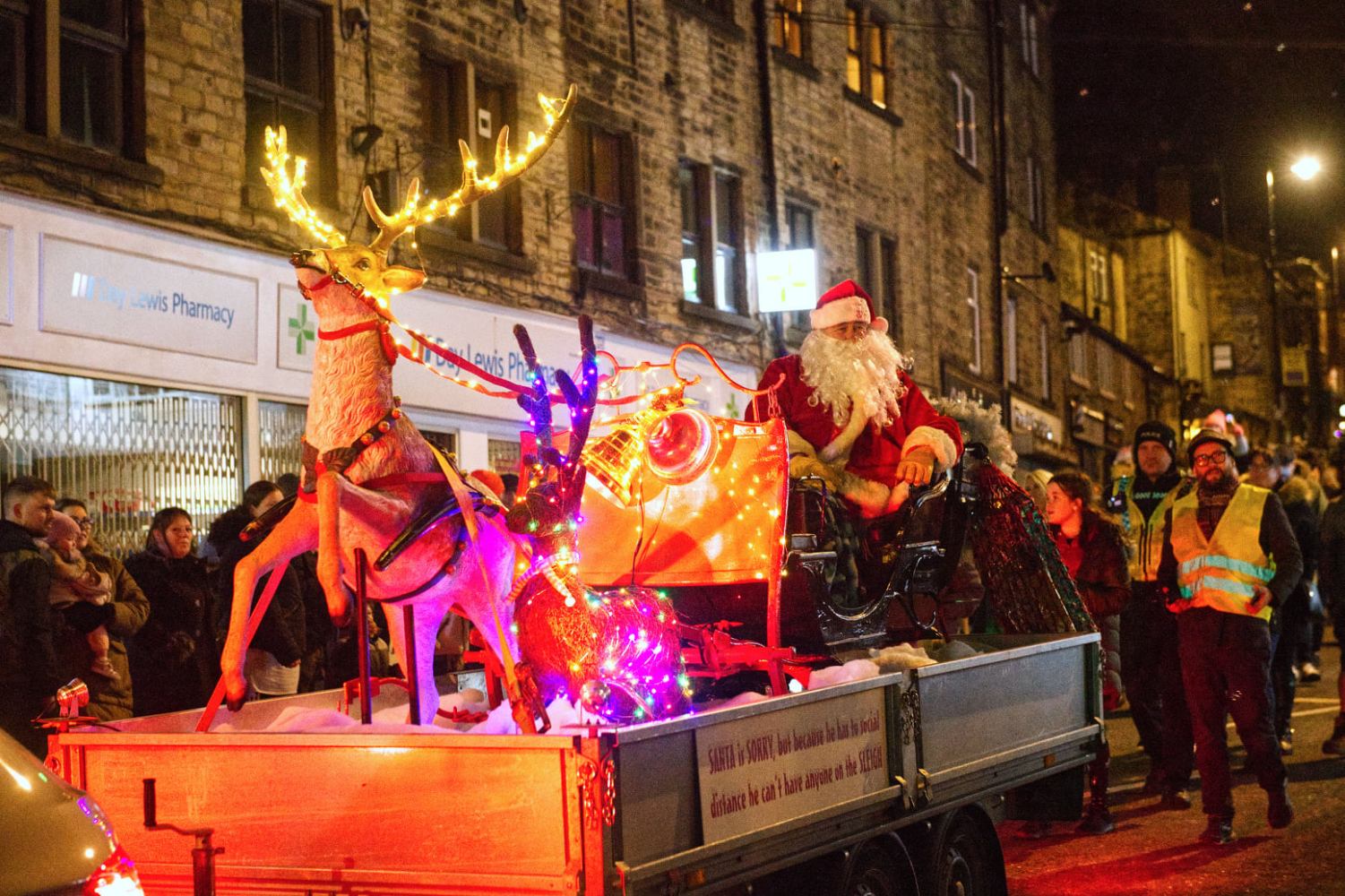 a group of people riding on the back of a truck